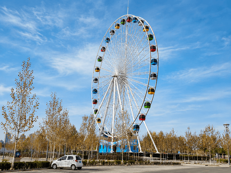 queue areas around a large ferris wheel